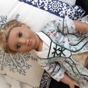 American Girl doll with dress & fancy hairdo